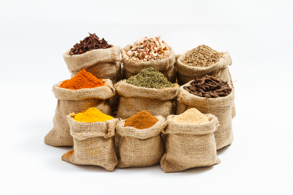 Group of indian spices and herbs difference ware on white background with normal view and copy space for design foods, vegetable, spices, herbs, healthy lifestyle or other your content.	