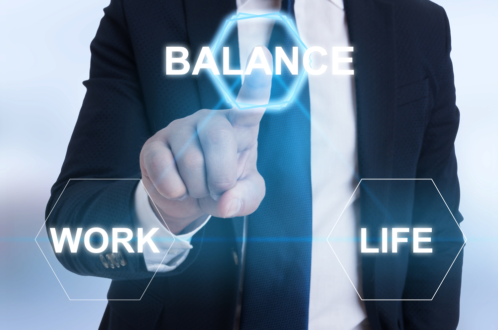 Entrepreneur hand pointing the balance icon between life and work