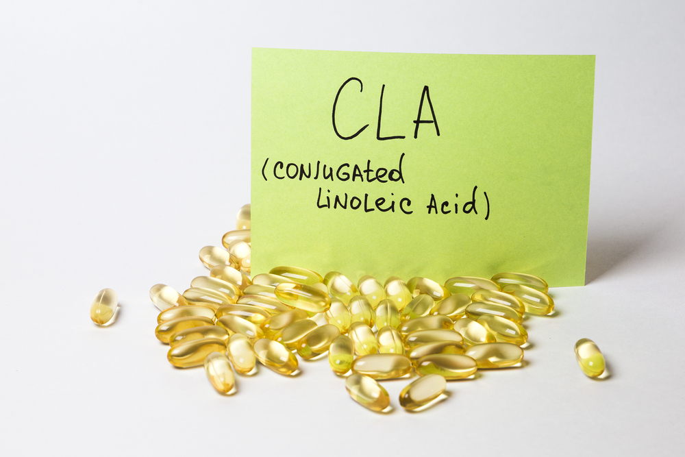 omega 6: conjugated linoleic acid (CLA) in capsules on the white background 